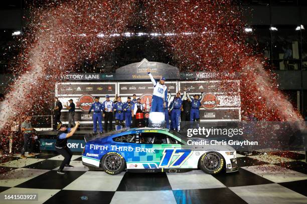 Chris Buescher, driver of the Fifth Third Bank Ford, celebrates in victory lane after winning the NASCAR Cup Series Coke Zero Sugar 400 at Daytona...