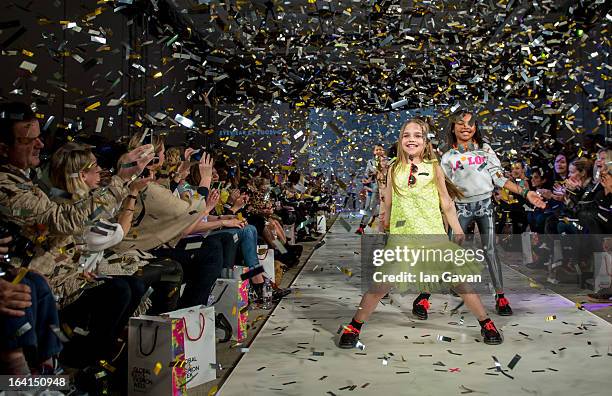 Models walk the runway at the Global Kids Fashion Week SS13 public show in aid of Kids Company at The Freemason's Hall on March 20, 2013 in London,...