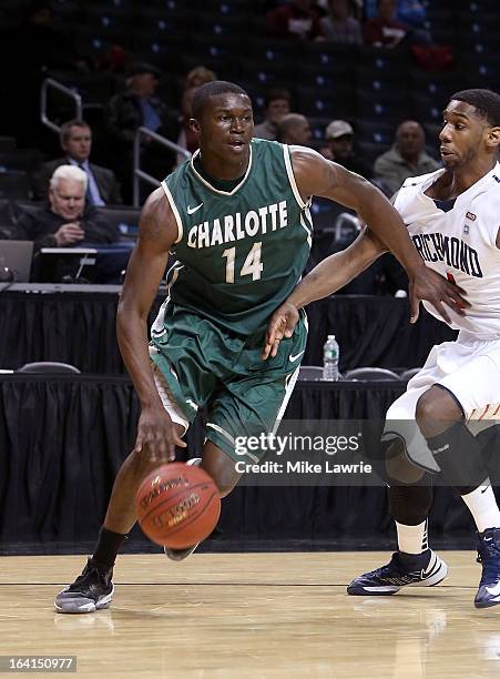 Terrence Williams of the Charlotte 49ers handles the ball against the Richmond Spiders during the first round of the Atlantic 10 basketball...
