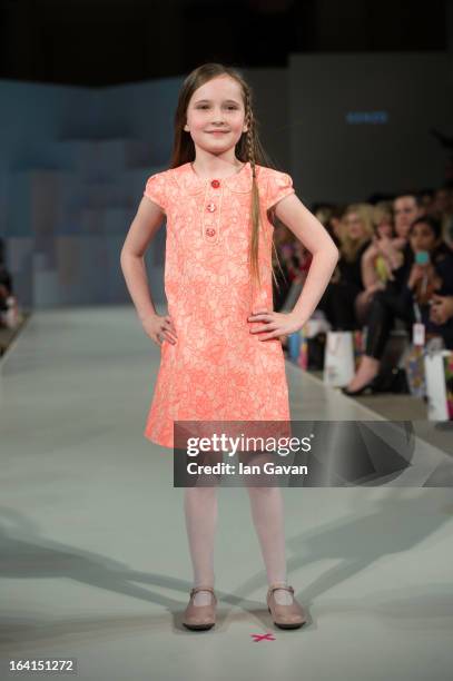 Model wearing Kenzo Spring/Summer '13 walks the runway at the Global Kids Fashion Week SS13 public show in aid of Kids Company at The Freemason's...