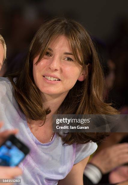 Jools Oliver enjoys the atmosphere during the Global Kids Fashion Week SS13 public show in aid of Kids Company at The Freemason's Hall on March 20,...