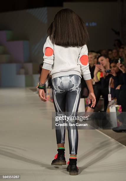 Model wearing La Loi Spring/Summer '13 walks the runway at the Global Kids Fashion Week SS13 public show in aid of Kids Company at The Freemason's...