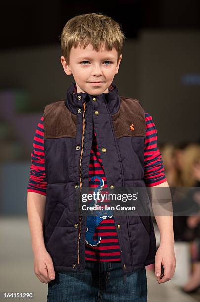 Model wearing Joules Spring/Summer '13 walks the runway at the Global Kids Fashion Week SS13 public show in aid of Kids Company at The Freemason's...