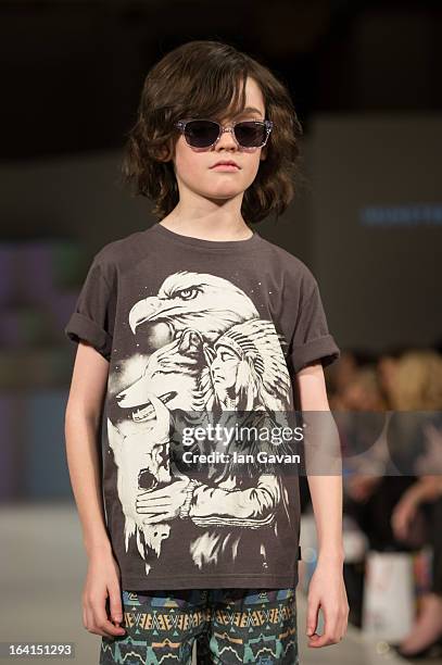 Model wearing Munster Kids Spring/Summer '13 walks the runway at the Global Kids Fashion Week SS13 public show in aid of Kids Company at The...