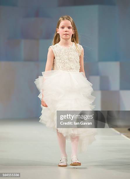 Model wearing Mischka Aoki Spring/Summer '13 walks the runway at the Global Kids Fashion Week SS13 public show in aid of Kids Company at The...