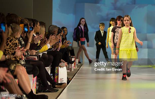 Models walk the runway at the Global Kids Fashion Week SS13 public show in aid of Kids Company at The Freemason's Hall on March 20, 2013 in London,...