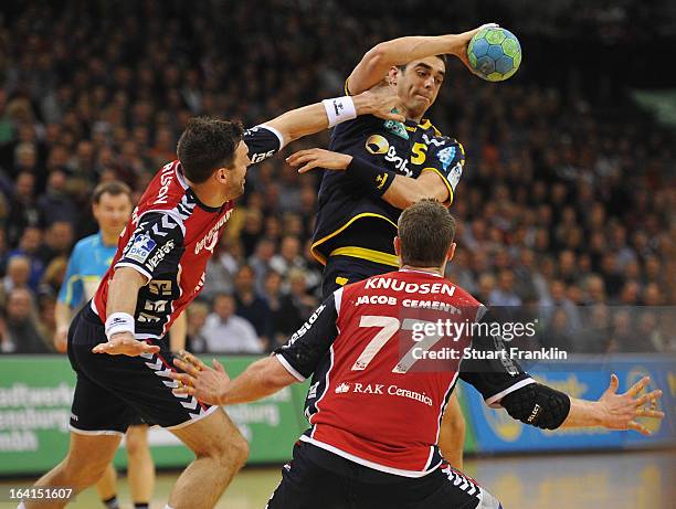 Tobias Karlsson of Flensburg challenges Zarko Sesum of Rhein-Neckar during the Toyota Bundesliga handball game between SG Flensburg-Handewitt and...