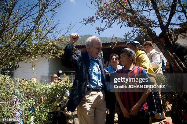 Tony Lake , Executive Director of the United Nations Children's Fund , speaks with a boy during a visit to the Paqui village, Totonicapan...