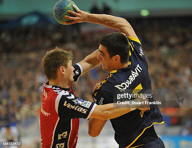 Lasse Svan Hansen of Flensburg challenges Zarko Sesum of Rhein-Neckar during the Toyota Bundesliga handball game between SG Flensburg-Handewitt and...