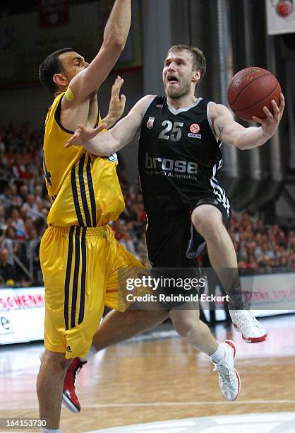 Anton Gavel, #25 of Brose Baskets Bamberg competes with Yassin Idbihi,#34 of Alba Berlin during the 2012-2013 Turkish Airlines Euroleague Top 16 Date...