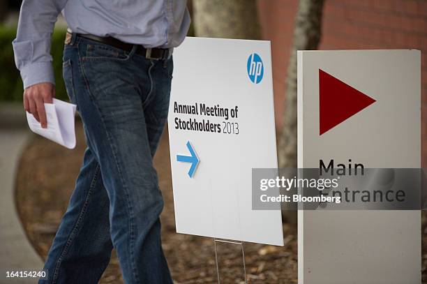 Shareholder arrives for the Hewlett-Packard Co. Annual meeting in Mountain View, California, U.S., on Wednesday, March 20, 2013. Hewlett-Packard Co....