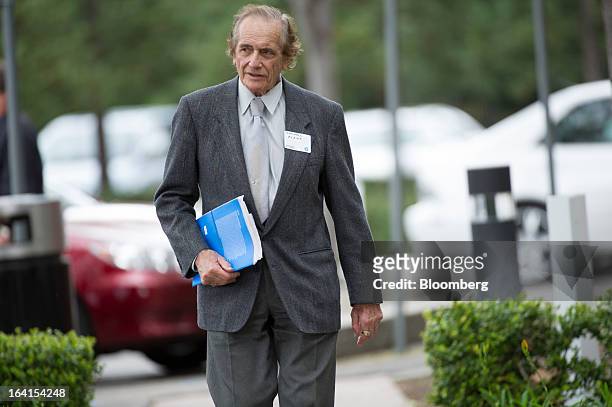 Shareholder arrives for the Hewlett-Packard Co. Annual meeting in Mountain View, California, U.S., on Wednesday, March 20, 2013. Hewlett-Packard Co....