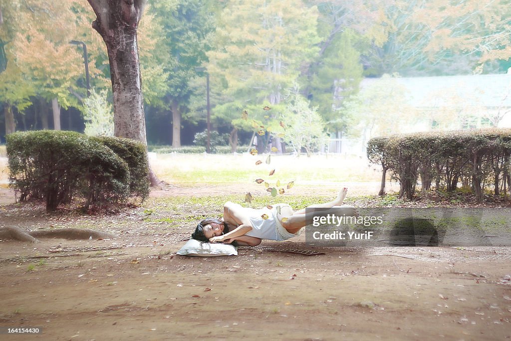 Woman sleeping on the ground.