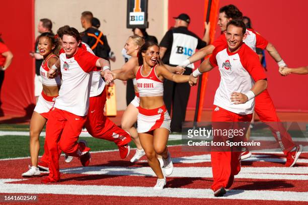 Ohio State Buckeyes cheerleaders run across the end zone after the Buckeyes scored a touchdown against the Indiana Hoosiers on September 2 at...