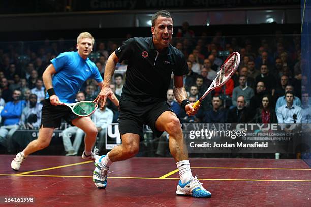 Peter Barker of England in action against Tom Richards of England during their quarter-final match in the Canary Wharf Squash Classic on March 20,...
