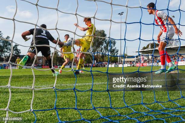 Luke Supyk of the Phoenix and Jamie Young of Melbourne City contest for the ball during the Australia Cup 2023 Round of 16 match between Melbourne...