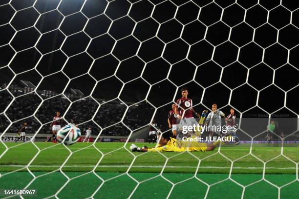 Takashi Usami of Gamba Osaka scores his team's first goal past Kaito Yamamoto of Vissel Kobe during the J.League Yamazaki Nabisco Cup quarter final...