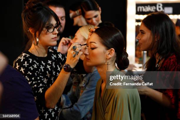 Bruna Tenorio prepares backstage at the Agua de Coco show during Sao Paulo Fashion Week Summer 2013/2014 on March 20, 2013 in Sao Paulo, Brazil.