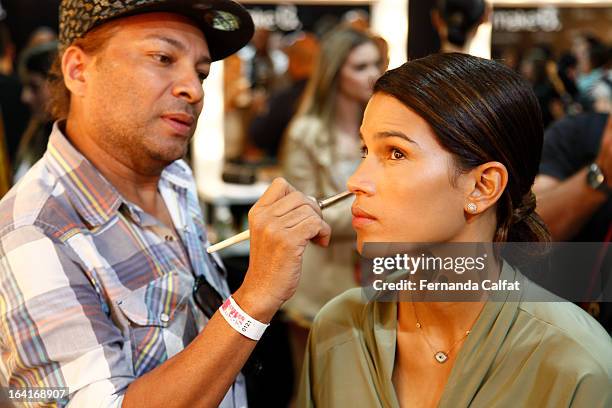 Models prepare backstage at the Agua de Coco show during Sao Paulo Fashion Week Summer 2013/2014 on March 20, 2013 in Sao Paulo, Brazil.