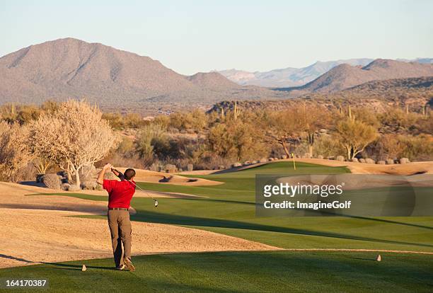 golfer driving off the tee in phoenix - phoenix arizona stock pictures, royalty-free photos & images