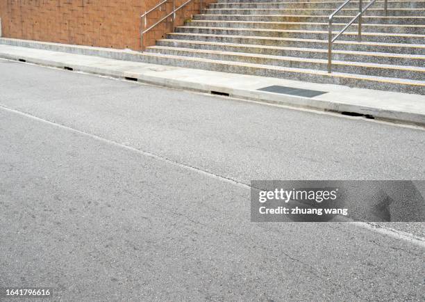 city pavement in singapore at daytime - curb stock pictures, royalty-free photos & images