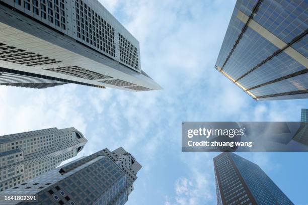 financial skyscrapers in singapore during daylight, low angle view - high street banks stock pictures, royalty-free photos & images