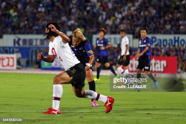 Takashi Usami of Gamba Osaka scores his team's second goal during the J.League Yamazaki Nabisco Cup quarter final second leg between Gamba Osaka and...