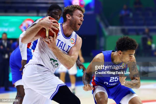 Nicolo Melli of Italy competes for the ball against Lester Quinones of the Dominican Republic in the first quarter during the FIBA Basketball World...