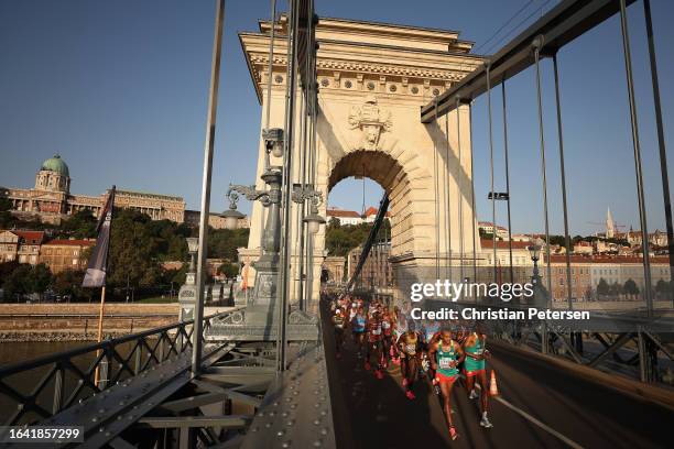 Leul Gebresilase and Tamirat Tola of Team Ethiopia lead the pack as they compete in the Men's Marathon Final during day nine of the World Athletics...