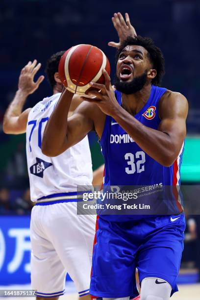 Karl-Anthony Towns of the Dominican Republic drives to the basket against Luigi Datome of Italy in the second quarter during the FIBA Basketball...