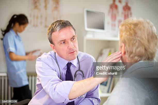ear infection - ear exam stock pictures, royalty-free photos & images