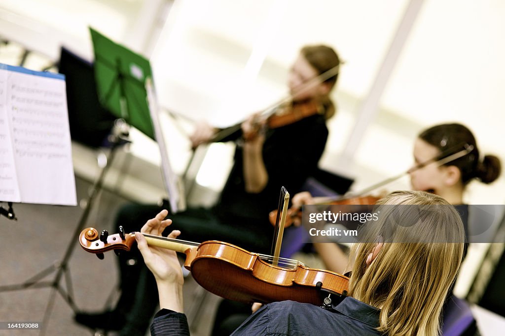 Teenagers Playing On Classical School Concert