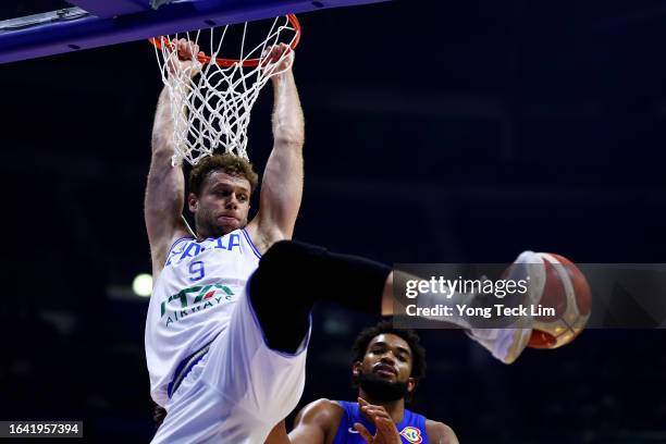 Nicolo Melli of Italy dunks the ball against Karl-Anthony Towns of the Dominican Republic in the third quarter during the FIBA Basketball World Cup...