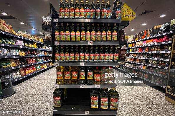 Bottles of olive oil and labels with high prices from a...