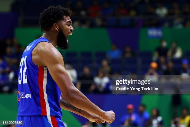 Karl-Anthony Towns of the Dominican Republic celebrates after the FIBA Basketball World Cup Group A victory over Italy at Araneta Coliseum on August...