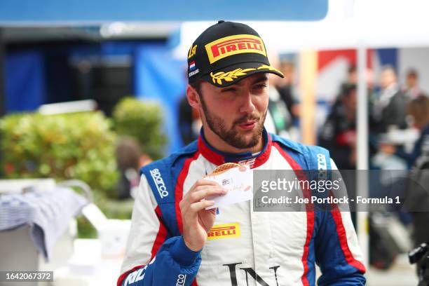 Race winner Clement Novalak of France and Trident enjoys a stroopwafel after the Round 12:Zandvoort Feature race of the Formula 2 Championship at...
