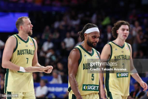 Australian players look dejected after the FIBA Basketball World Cup Group E game between Australia and Germany at Okinawa Arena on August 27, 2023...