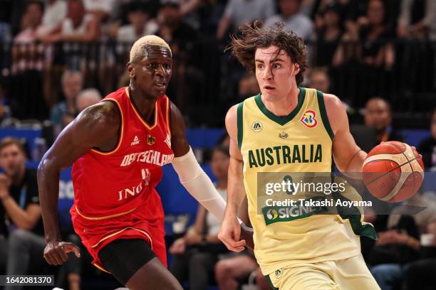 Josh Giddey of Australia drives to the basket against Isaac Bonga of Germany during the FIBA Basketball World Cup Group E game between Australia and...