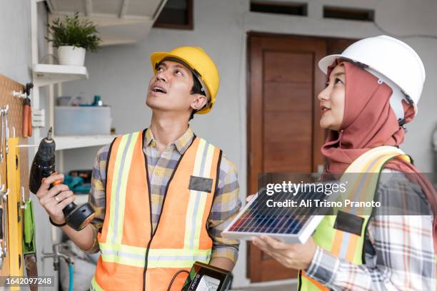 young couple , home improvement, home planning - banten stock pictures, royalty-free photos & images