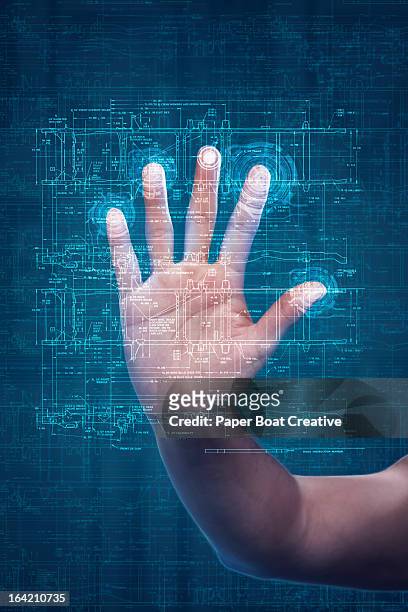 Hand touching digital scanner in studio background