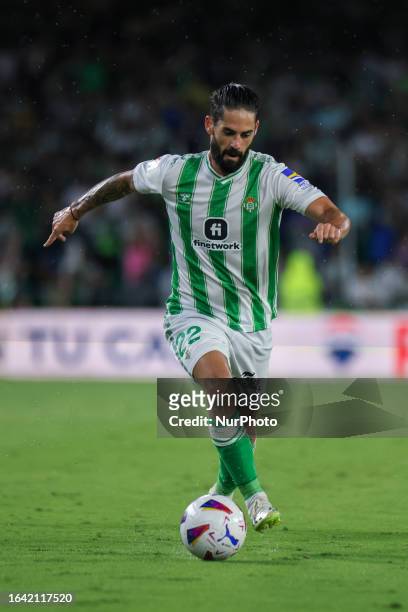 Francisco Roman Alarcon Suarez ''Isco'' of Real Betis runs with the ball to the LaLiga EA Sports match between Real Betis and Rayo Vallecano at...