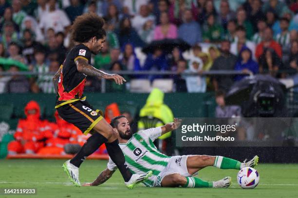 Francisco Roman Alarcon Suarez ''Isco'' of Real Betis competes for the ball with Aridane Hernandez of Rayo Vallecano to the LaLiga EA Sports match...