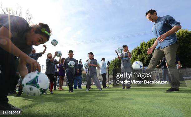 Professional basketball player Steve Nash of the Los Angeles Lakers practices a soccer drill with children from The Salvation Army Red Shield Youth &...