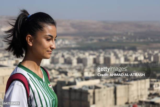 Rolaf Horo, 22-year-old Kurdish-Syrian footballer and coach, poses for a picture ahead of a training session for girls in the rebel-held Afrin region...
