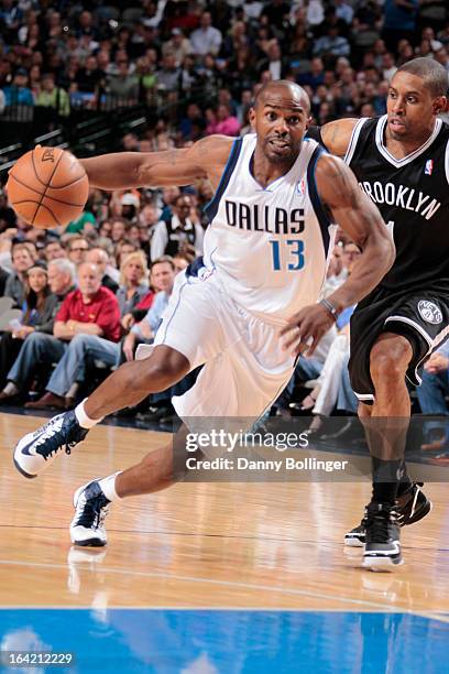 Mike James of the Dallas Mavericks drives against C.J. Watson of the Brooklyn Nets on March 20, 2013 at the American Airlines Center in Dallas,...