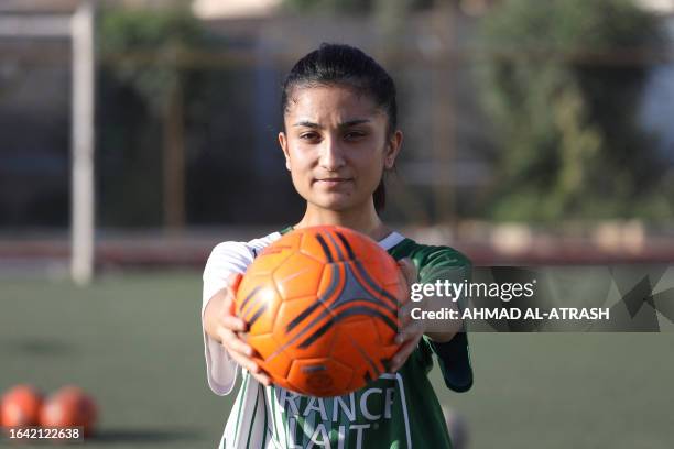 Rolaf Horo, 22-year-old Kurdish-Syrian footballer and coach, poses for a picture during a training session for girls in the rebel-held Afrin region...