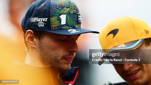 Max Verstappen of the Netherlands and Oracle Red Bull Racing talks with Lando Norris of Great Britain and McLaren on the drivers parade prior to the...