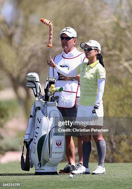 Ai Miyazato of Japan takes a club from her bag during the final round of the RR Donnelley LPGA Founders Cup at Wildfire Golf Club on March 17, 2013...