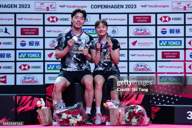 Seo Seung Jae and Chae Yu Jung of Korea pose with their medals on the podium after the Mixed Double Finals match against Zheng Siwei and Huang...