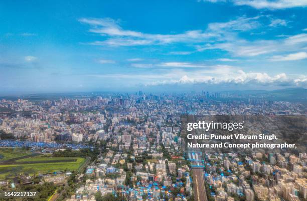 aerial view of mumbai city and railway tracks of the local train as viewed from the above. - singh stock pictures, royalty-free photos & images